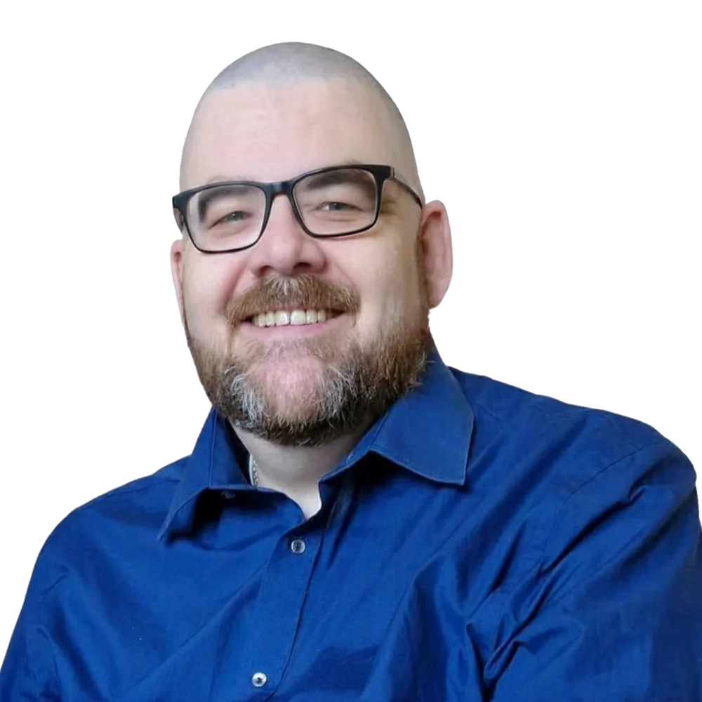 Sean Hegarty smiling, in a blue shirt